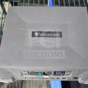 Sensormatic ZBSMPROE antenna deactivator, used, dark gray, visible power and connection ports, branded label on top.