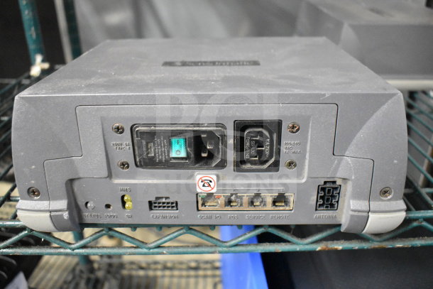 Two Sensormatic ZBSMPROE antenna deactivators in used condition, with visible input and output ports and power connectors.
