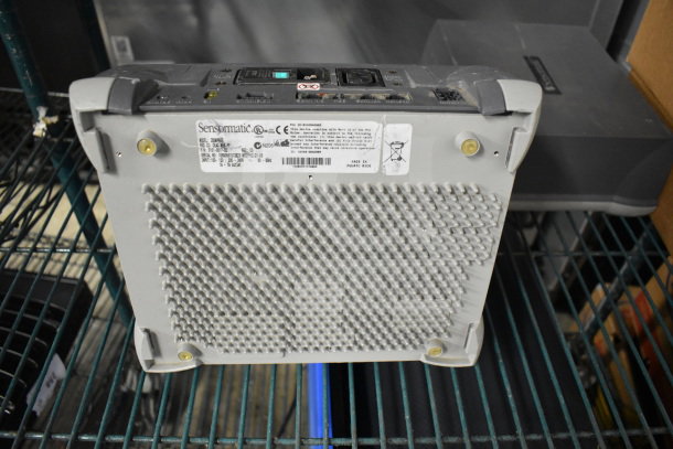 2 Sensormatic ZBSMPROE Antenna Deactivators, shown from underneath on a shelf, with labels and port details visible.