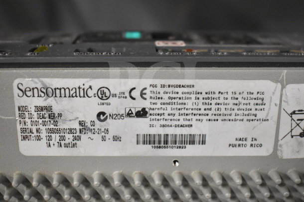 Sensormatic ZBSMPROE Antenna Deactivator label, details model, serial, and compliance info. Made in Puerto Rico.