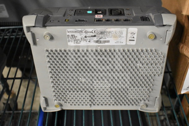 Two Sensormatic ZBSMPROE antenna deactivators, with visible model and serial labels, in good condition.