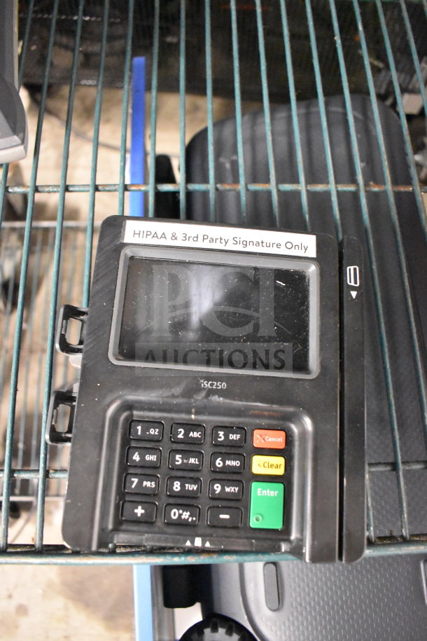 Four Ingenico ISC250 credit card readers, good condition, visible keypad and screen, labeled "HIPAA & 3rd Party Signature Only."