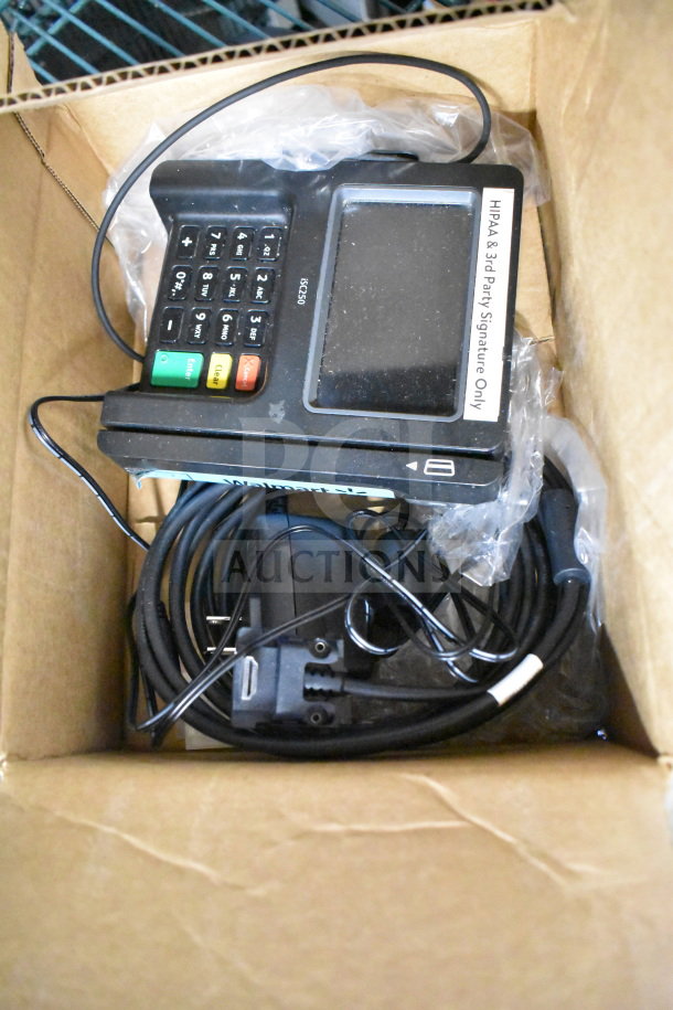 Ingenico ISC250 credit card reader in box, includes cables; label reads "HIPAA & 3rd Party Signature Only." Four units available.