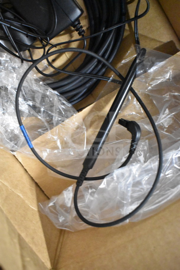 Ingenico ISC250 credit card reader with cables in packaging. Auction includes four units. Condition unspecified.