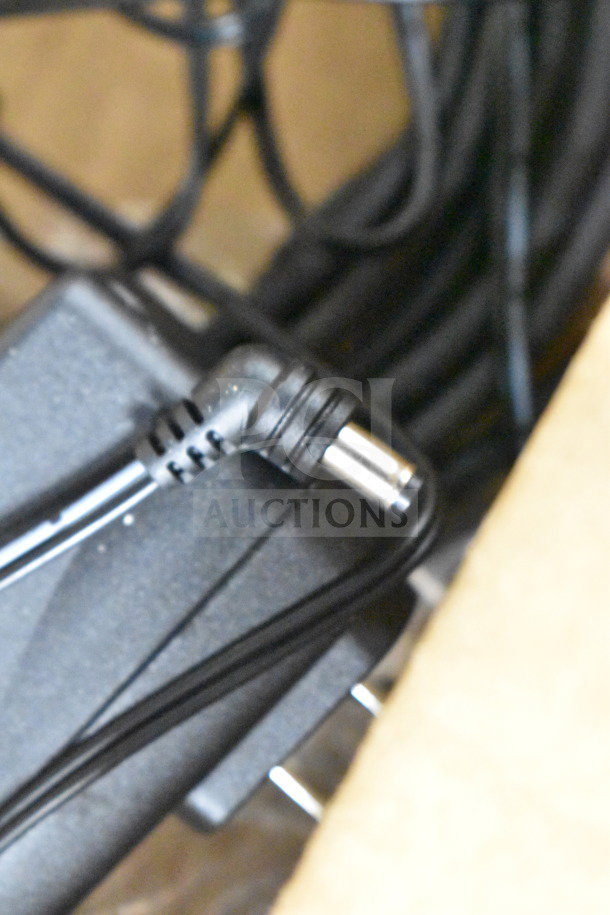Close-up view of a connector plug and cable associated with Ingenico ISC250 credit card reader.