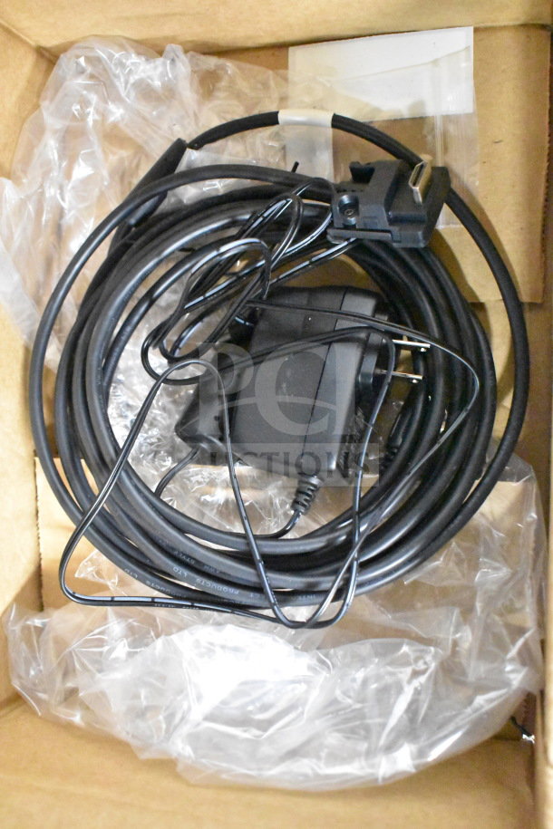 Box containing cords and parts for Ingenico ISC250 credit card reader, bundled and wrapped, new condition.