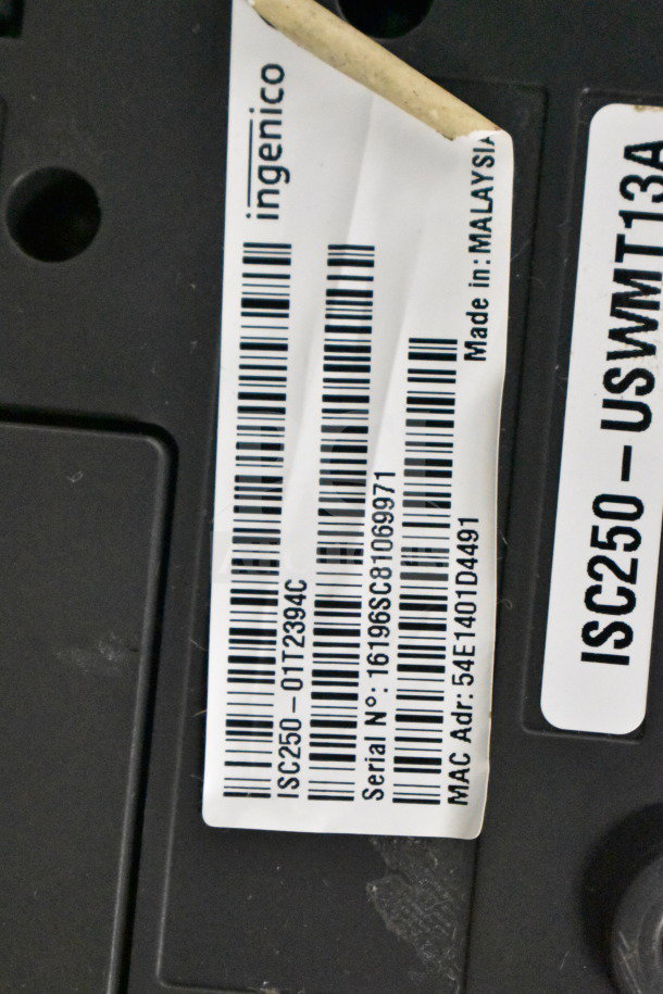 Ingenico ISC250 credit card reader with visible barcode label showing serial number 16196SC81069971. Made in Malaysia.