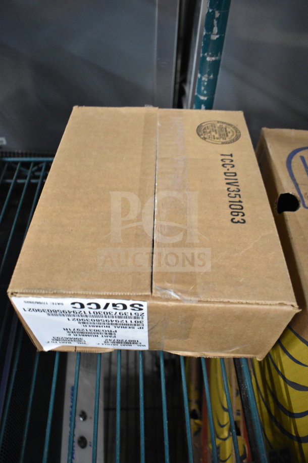 Box of 4 Ingenico ISC250 credit card readers, new condition, labeled with product details, model ISC250, sealed in box.