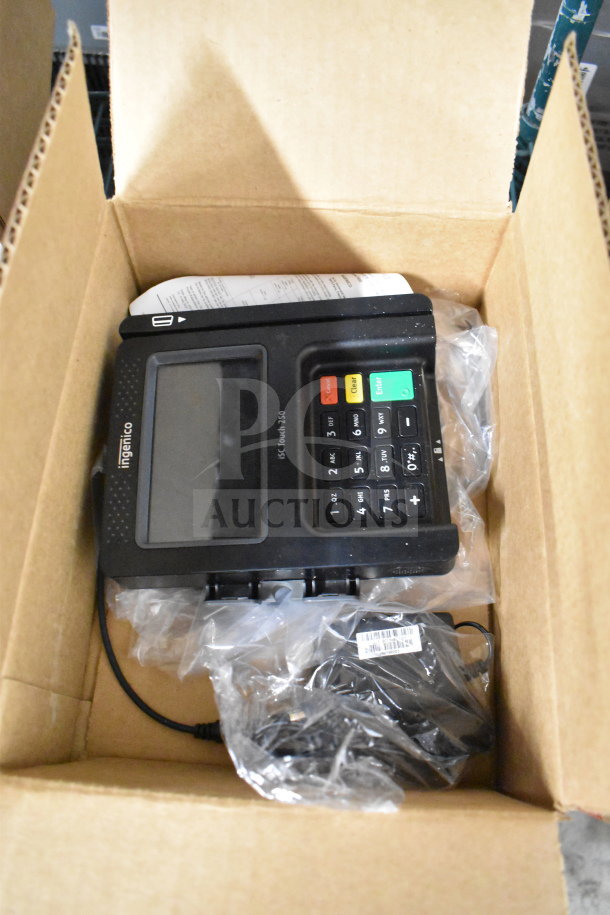 Ingenico ISC250 credit card reader in box, touchscreen, number keypad, new condition, includes cables and manual.