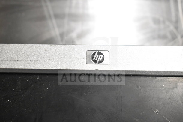 8 various monitors including Toshiba, HP, and Onn. Visible HP logo on one monitor. Condition varies.
