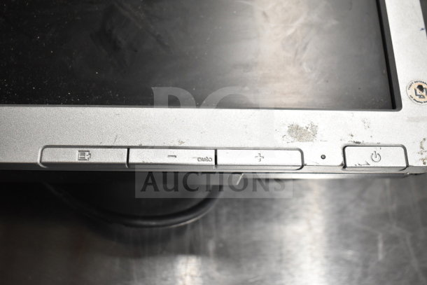 Eight assorted monitors including Toshiba, HP, and Onn. Visible wear and control buttons; ideal for bulk purchase.
