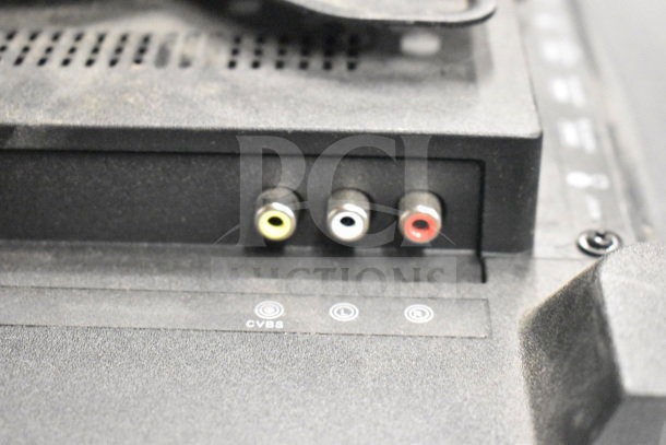 Close-up of ports on a monitor, showing yellow, white, and red RCA connectors labeled CVBS, L, and R. Dust visible, indicating used condition.