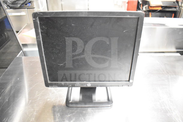 8 monitors in various brands including Toshiba, HP, Onn. HP monitor shown with visible wear. Auction, bid x8.