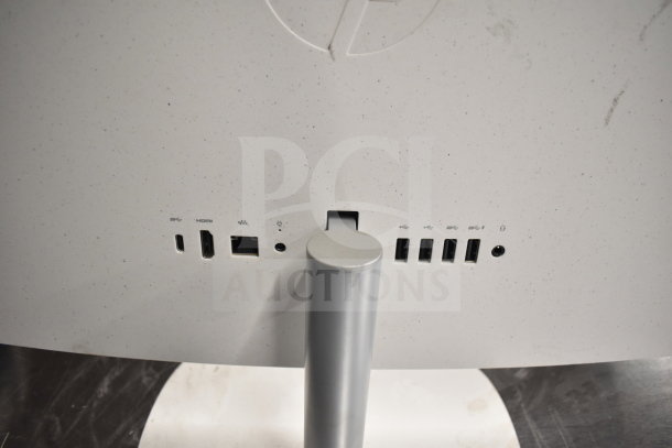 Close-up of monitor back showing USB, HDMI, Ethernet ports, and power connector. Part of an auction lot of 8 monitors.