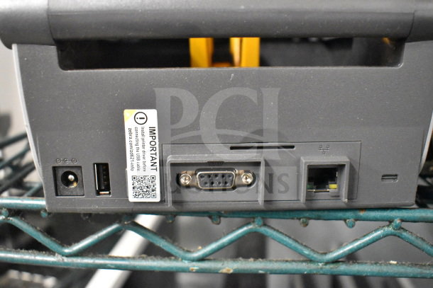Zebra ZD621 Desktop Direct Thermal Barcode Printer, rear view, showing power and connectivity ports. Label advises driver installation.