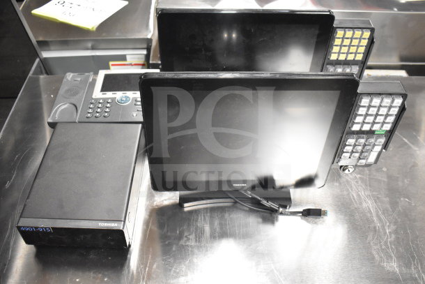 Auction items: Toshiba monitors, corded office telephone, and receipt printers. Includes multiple items for bidding.