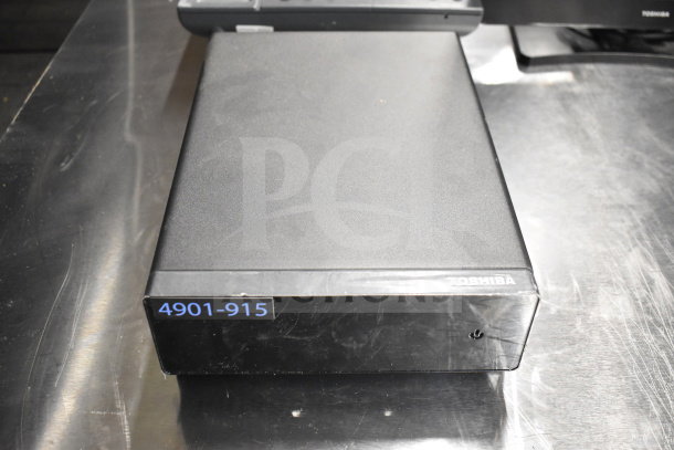 Toshiba monitor on table, visible model number 4901-915. Black casing, good condition, part of a 15-item auction lot.
