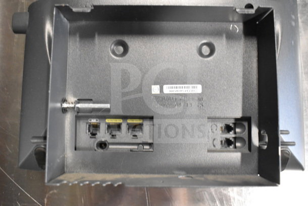 Back panel of an electronic device with visible ports and a barcode label, part of auction lot of 15 items.