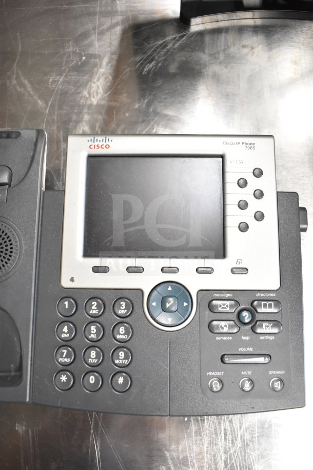 Cisco IP Phone 7965, features a digital display, keypad, volume controls, in good condition, visible label V-137.