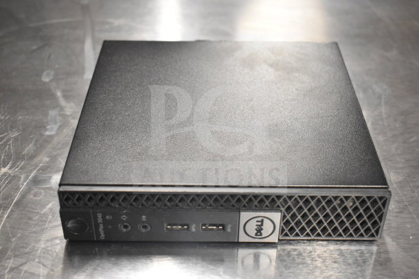 Dell Optiplex 3040 micro desktop in good condition, featuring front USB ports and audio jacks.