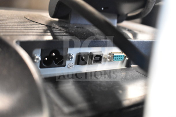 Back panel of Toshiba monitor showing various ports, including power input, USB, and VGA connections.