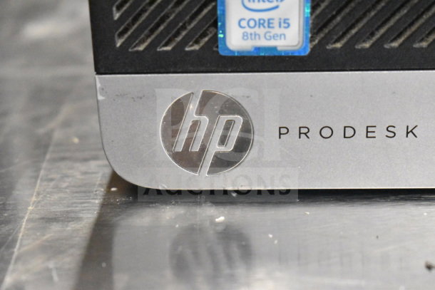 Close-up of HP ProDesk with Intel Core i5 8th Gen sticker, silver finish, part of 15 various auction items.