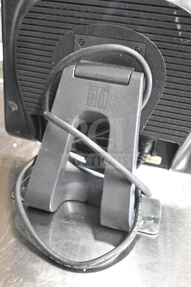 Back of Toshiba monitor with stand and connected power cable, part of a 15-item mixed lot. Good condition.