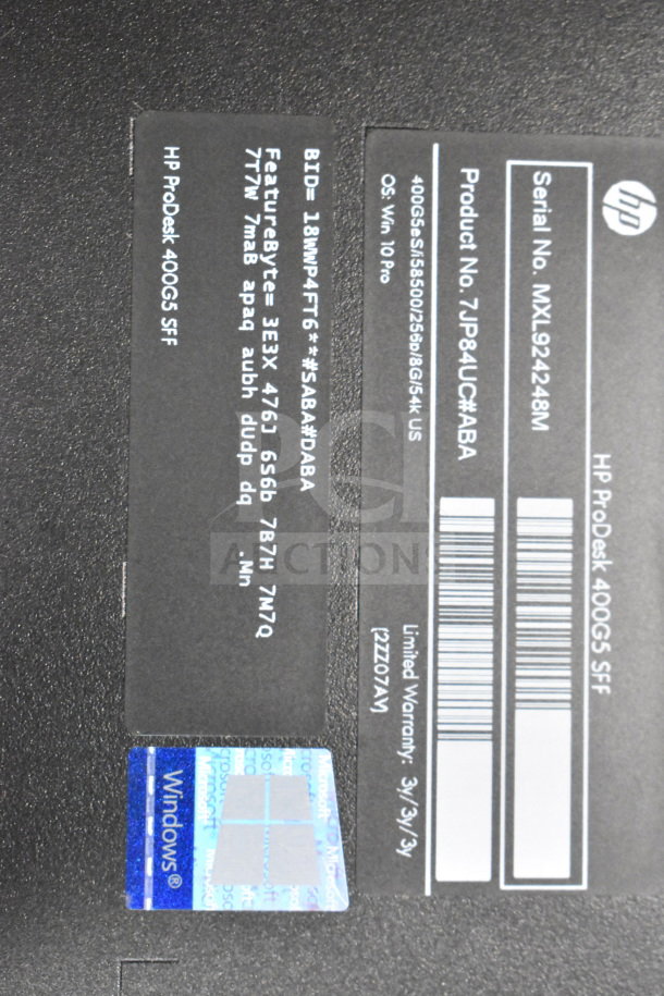 Close-up of a label on an HP ProDesk 400 G5 SFF computer. Features Windows OS label and product details.
