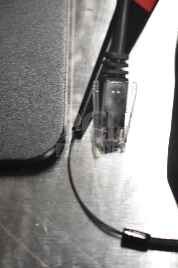 Variety of electronic components, including cables, displayed on a metallic surface. Condition not clearly visible.