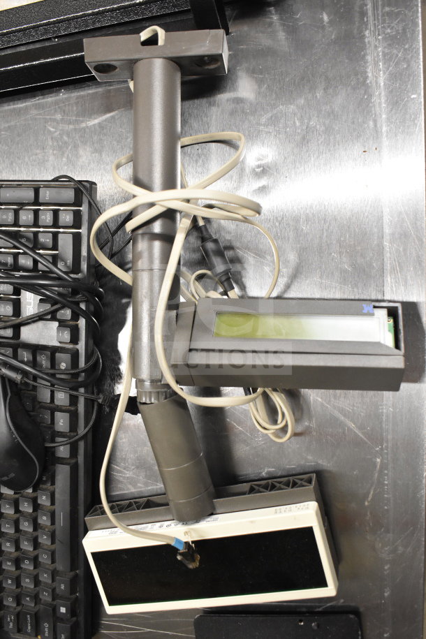 15 various items including receipt printer, keyboard, credit card reader, and cash drawer insert, shown on a metal surface.