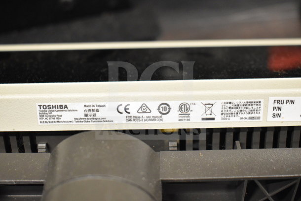 Label on electronics includes Toshiba branding, model SS-05L, compliance icons, and manufacturing details.