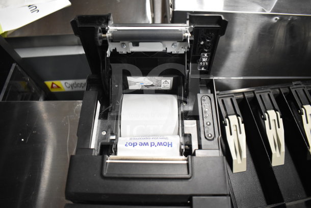 Receipt printer with exposed paper roll, part of a lot including a keyboard, credit card reader, and cash drawer insert.