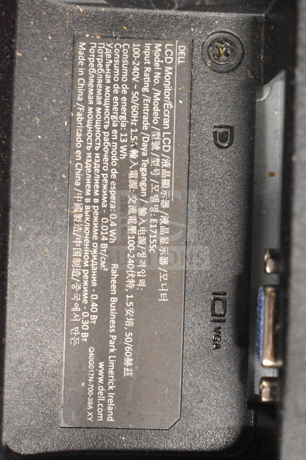 Close-up of a Dell LCD Monitor label showing model E115SC, input rating 100-240V, made in China.