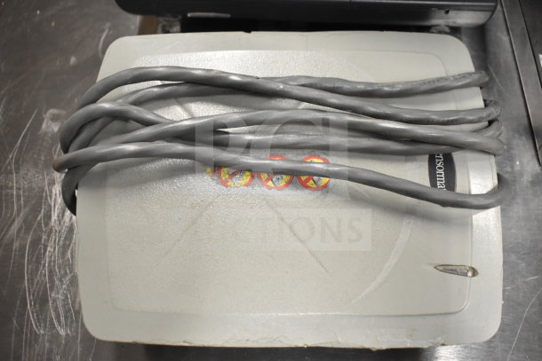 12 electronics lot including Dell computer towers, corded office telephones, and credit card reader. Auction item, mixed condition.