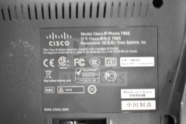 Label on Cisco IP Phone 7965 showing manufacturer details, compliance symbols, and "Made in China" marking.