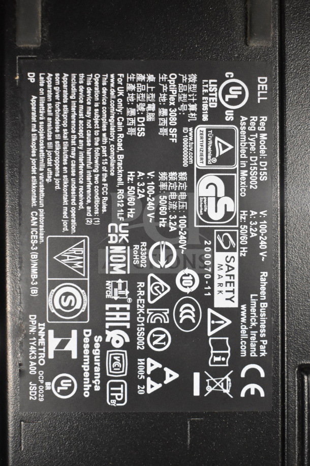 Label on Dell OptiPlex 3080 SFF computer tower. Model D15S, voltage 100-240V, compliance and safety markings visible.