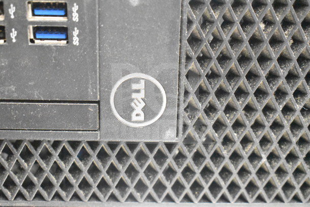 Dell computer tower close-up, showing USB ports and logo. Auction includes 12 items like office phones and card reader.