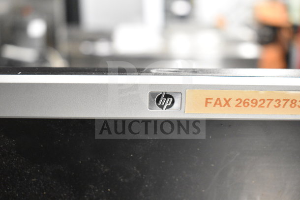 HP monitor with visible logo and fax number label "269273784" on the front panel. Condition appears used.
