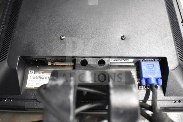 Rear view of a Hewlett-Packard device showing connection ports and model label with serial number.