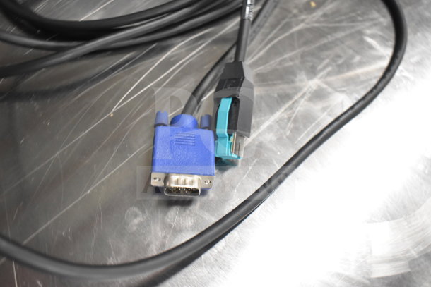 Close-up of cables including VGA and USB connectors on a metallic surface, part of a 12-item electronics auction bundle.