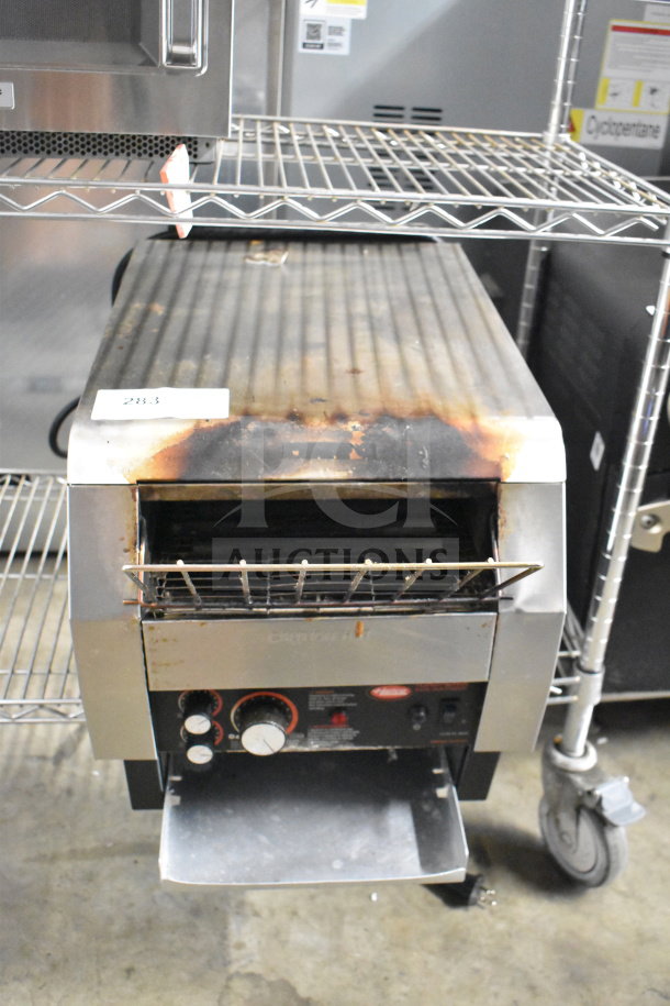 Hatco TQ-800HBA commercial countertop conveyor toaster oven. Visible wear, 208 volts, 1 phase. Model TQ-800HBA tag shown.