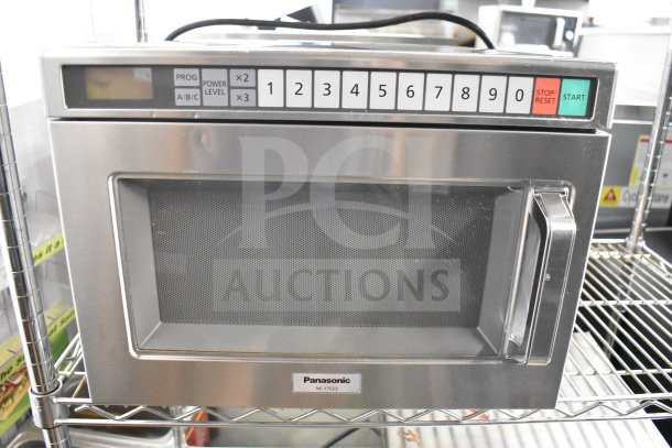 Panasonic NE-17523 commercial countertop microwave, 230V, 1 phase, stainless steel, keypad controls, visible brand logo.