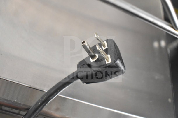 Panasonic NE-17523 commercial microwave plug detail, showing 230V compatibility. Cord appears in good condition.