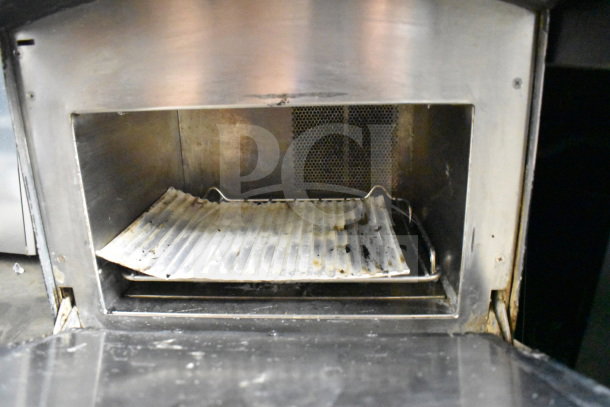 2017 Turbochef NGO rapid cook oven, stainless interior with a ribbed tray, used condition. 208/240V, 1 phase.