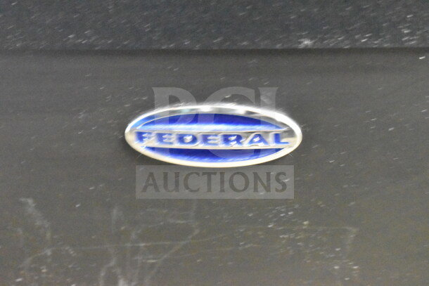 Federal Commercial Floor Style Island Grab N Go Merchandiser logo. Blue oval with "Federal" in silver.