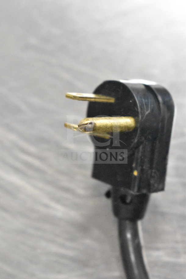 Close-up of a 115-volt power plug for a True TUC-60G 2 Door Undercounter Cooler Merchandiser in good condition.