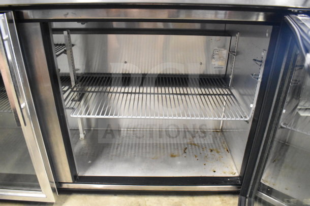 True TUC-60G Commercial 2 Door Undercounter Cooler, 115V, 1 Phase, stainless steel interior, visible shelving, clean condition.