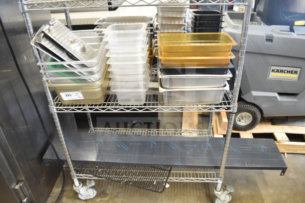 Two-tier metal cart with assorted plastic and metal drop-in bins in various sizes, auction tag #293 visible.
