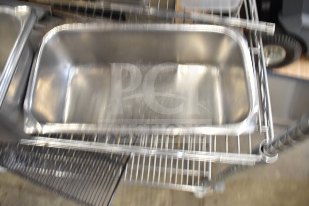 Two-tier lot with stainless steel drop-in bins on wire shelving, various items included, suitable for kitchen use.