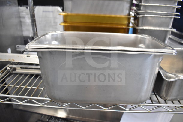 Two-tiered lot of metal drop-in bins on a shelf. Bins in good condition, various sizes, ideal for storage or organization.